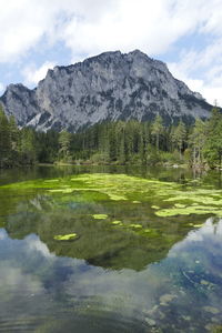 Scenic view of lake and mountains against sky