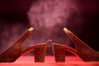 Close up of red and crane against gray background