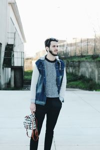 Young man standing outdoors