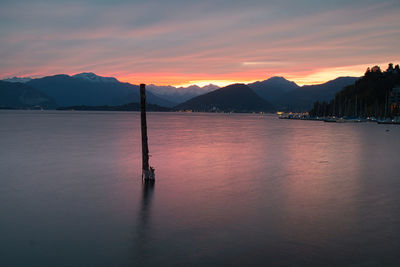 Scenic view of lake against sky during sunset