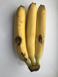 High angle view of bananas against white background