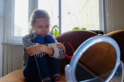 Portrait of smiling girl sitting