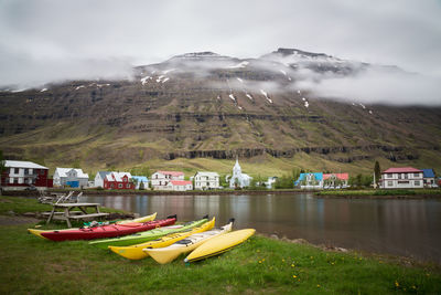 Boats in water against sky