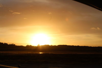 Scenic view of silhouette landscape against sky during sunset