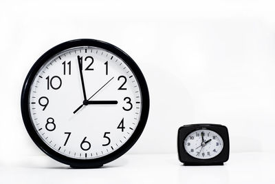 Close-up of clock on wall