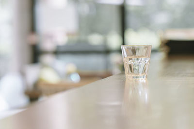Empty glass on table