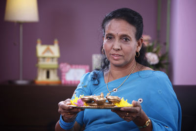 Portrait of smiling woman at home