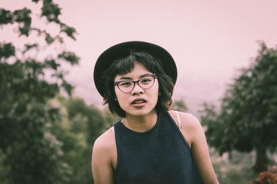 Portrait of woman against sky