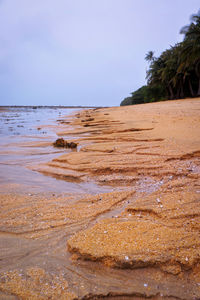 Scenic view of beach against clear sky