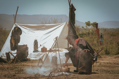 Panoramic view of tent on field against sky