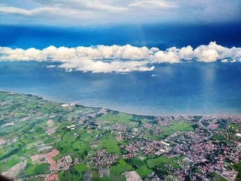 Scenic view of landscape against cloudy sky