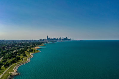 Panoramic view of sea against blue sky