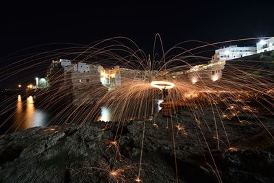 Light trails against sky at night