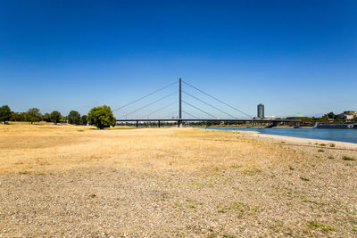 View of bridge against clear blue sky