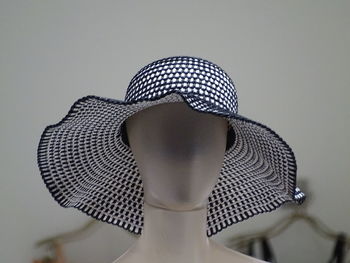 Close-up of hat on female mannequin in store