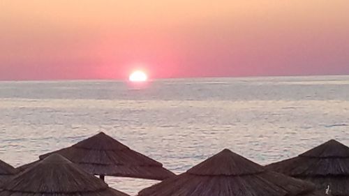 Scenic view of sea against sky at sunset