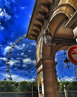 Low angle view of built structure against blue sky