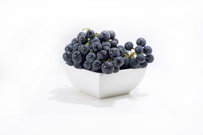 High angle view of blueberries against white background