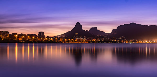 Illuminated city at waterfront