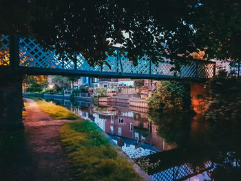 Bridge in city against sky