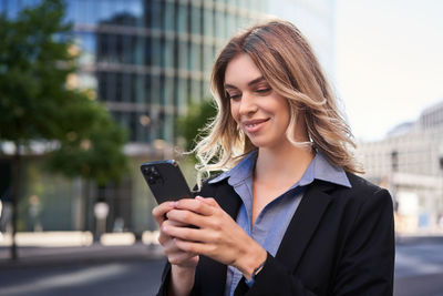 Young woman using mobile phone