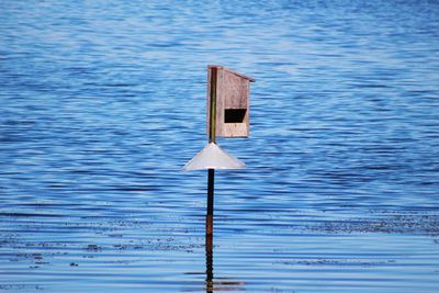 Wooden posts in lake