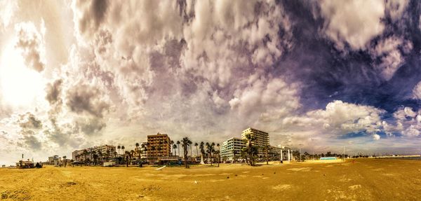 Lighthouse against cloudy sky