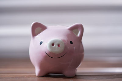 Close-up of piggy bank on table