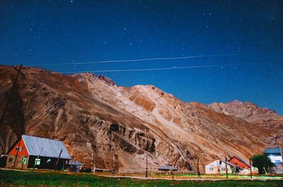 Scenic view of mountains against clear blue sky