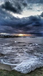 Scenic view of sea against cloudy sky