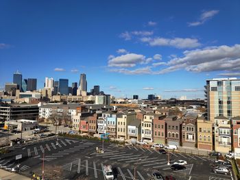 High angle view of city street and buildings against sky