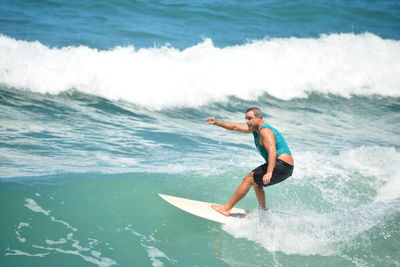 Man surfing in sea