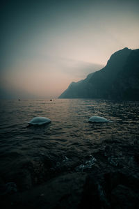 Scenic view of sea against sky at sunset