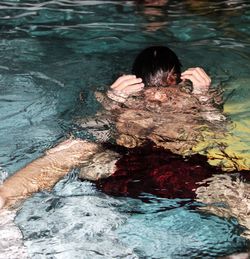 High angle view of person swimming in pool