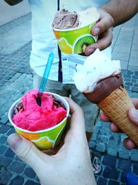 Midsection of woman holding ice cream