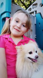 Portrait of cute girl with dog