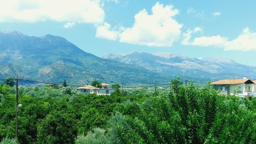 Scenic view of mountains against cloudy sky