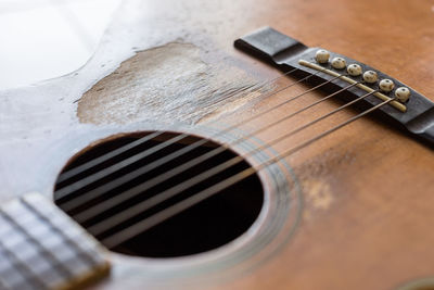 High angle view of guitar on table