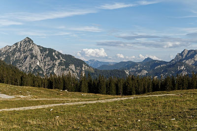 Scenic view of landscape and mountains against sky