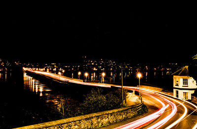 High angle view of light trails on road at night