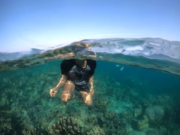 Man swimming in sea, indonesia is beautifull