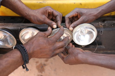 Midsection of man working on glass