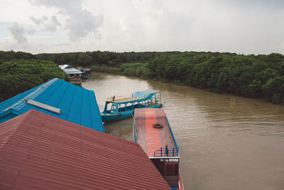 High angle view of boats moored on river against sky