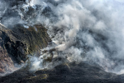 Smoke emitting from volcanic mountain