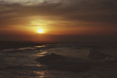 Scenic view of sea at sunset