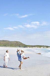 Mother daughter and grandmother spending a day at the beach