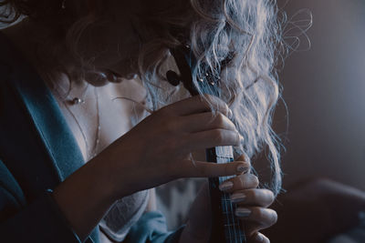 Close-up portrait of woman drinking water