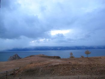 Scenic view of sea against cloudy sky