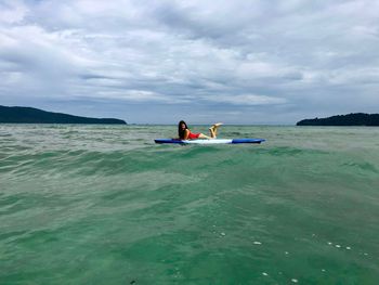 Smiling woman on paddleboard 