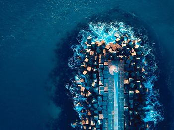 High angle view of people swimming in sea